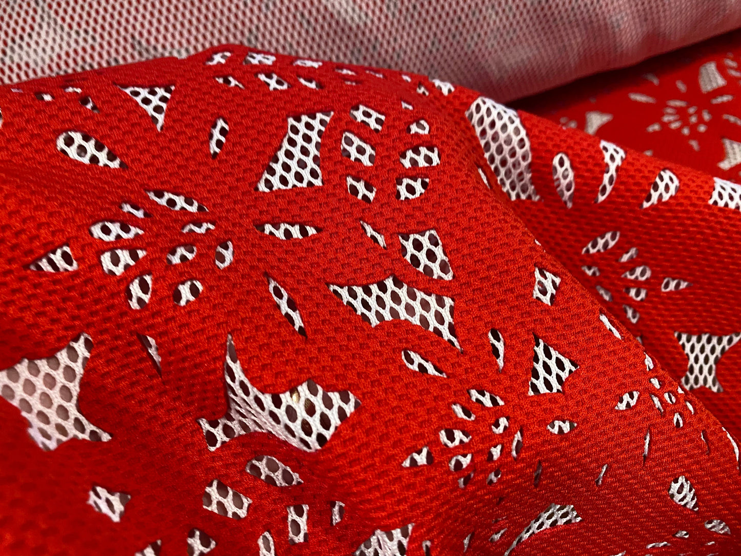 Fishnet fabric with bonded floral overlay, per metre - flower design - red on white