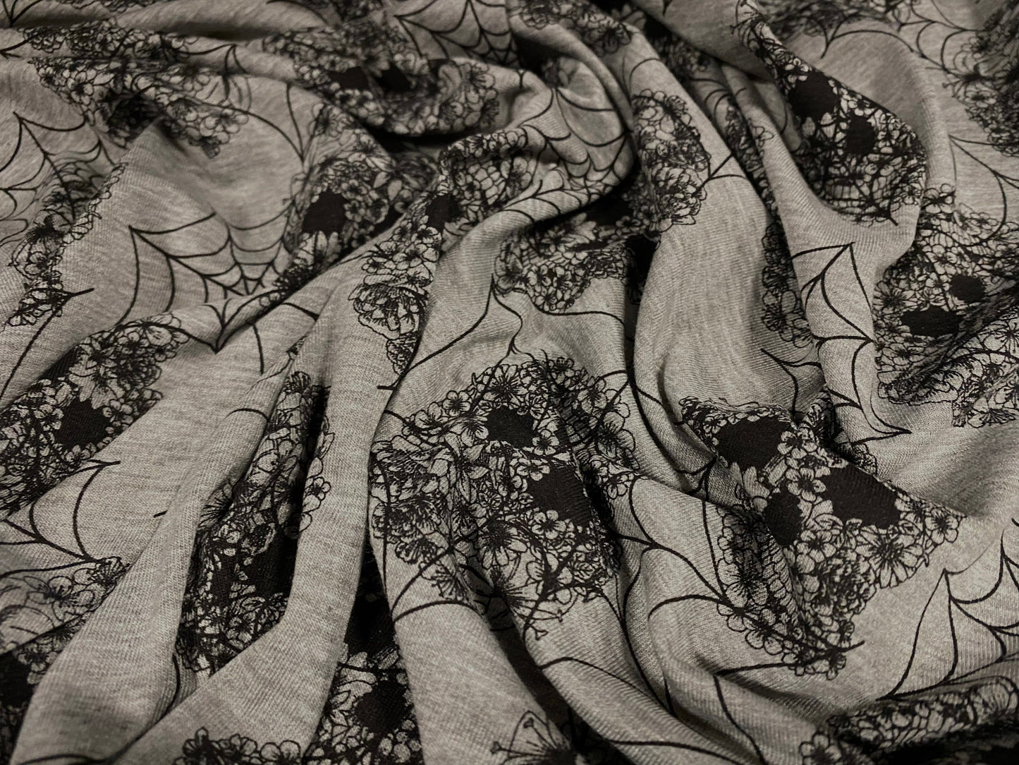 Single jersey dress fabric, per metre - floral skulls and cobwebs print - grey marl