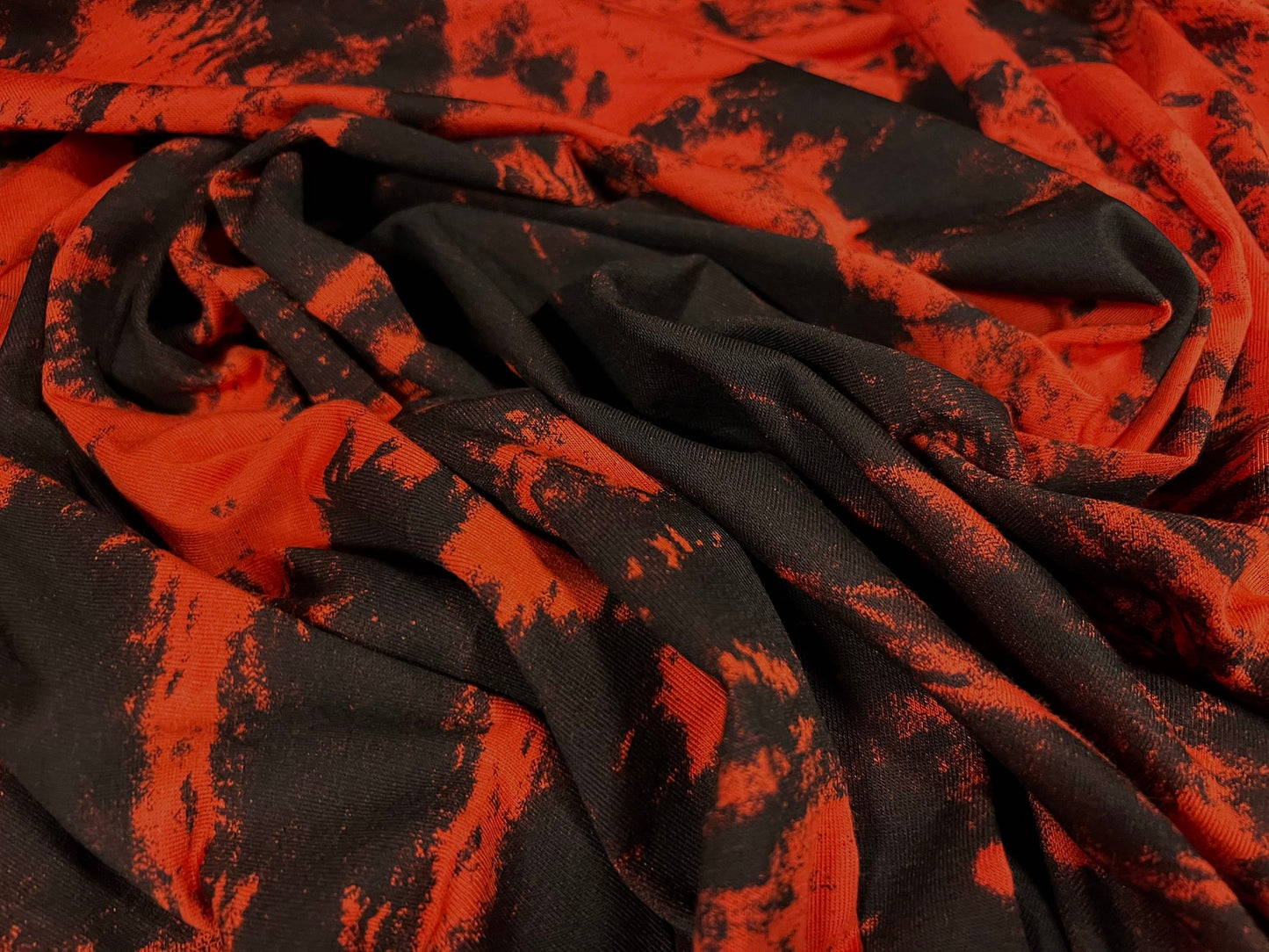 Viscose spandex stretch single jersey fabric, per metre - Tie dye print - Orange & black