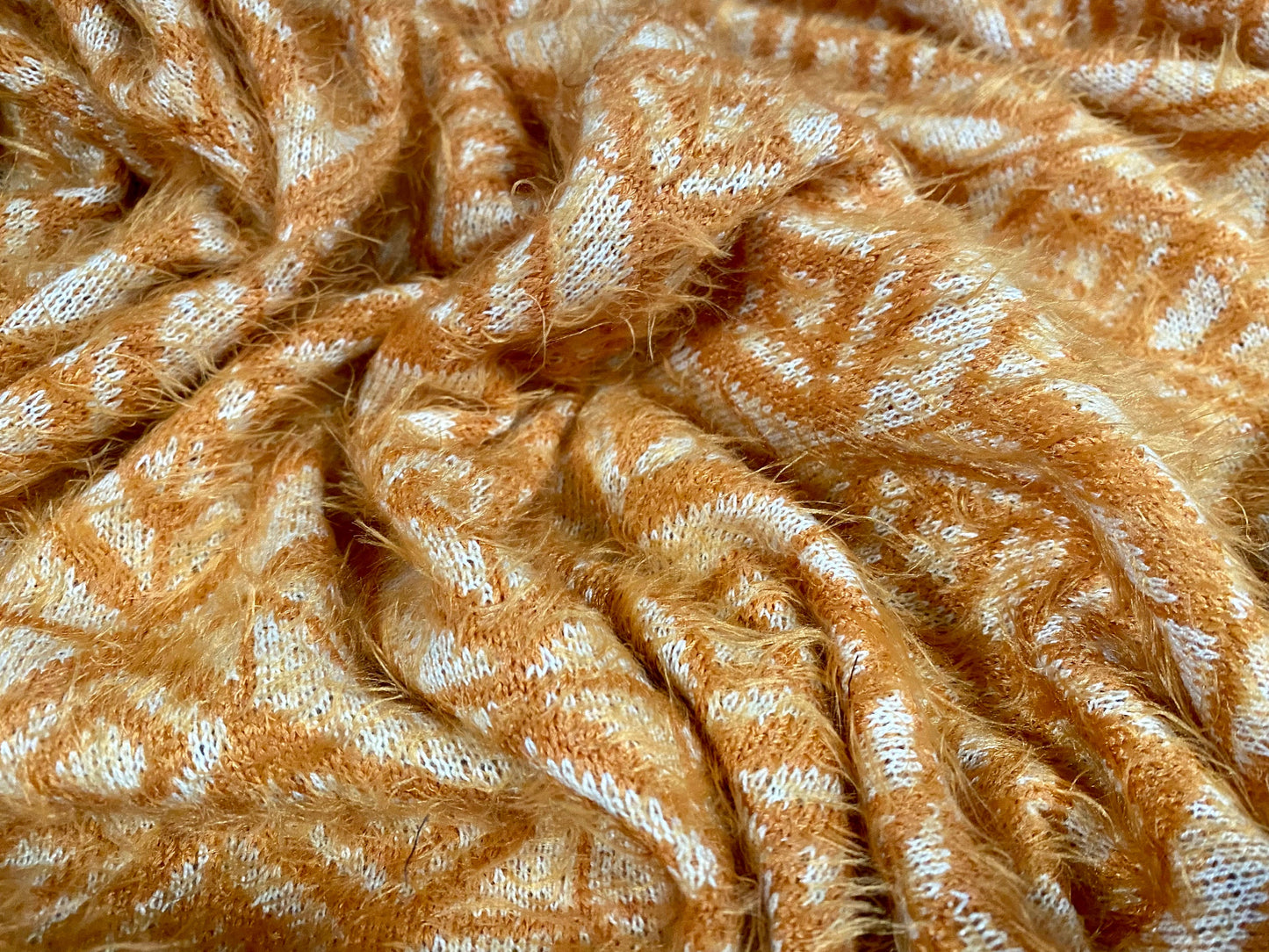 Soft hairy mohair style knitwear jersey fabric, per metre - geometric jacquard - Orange