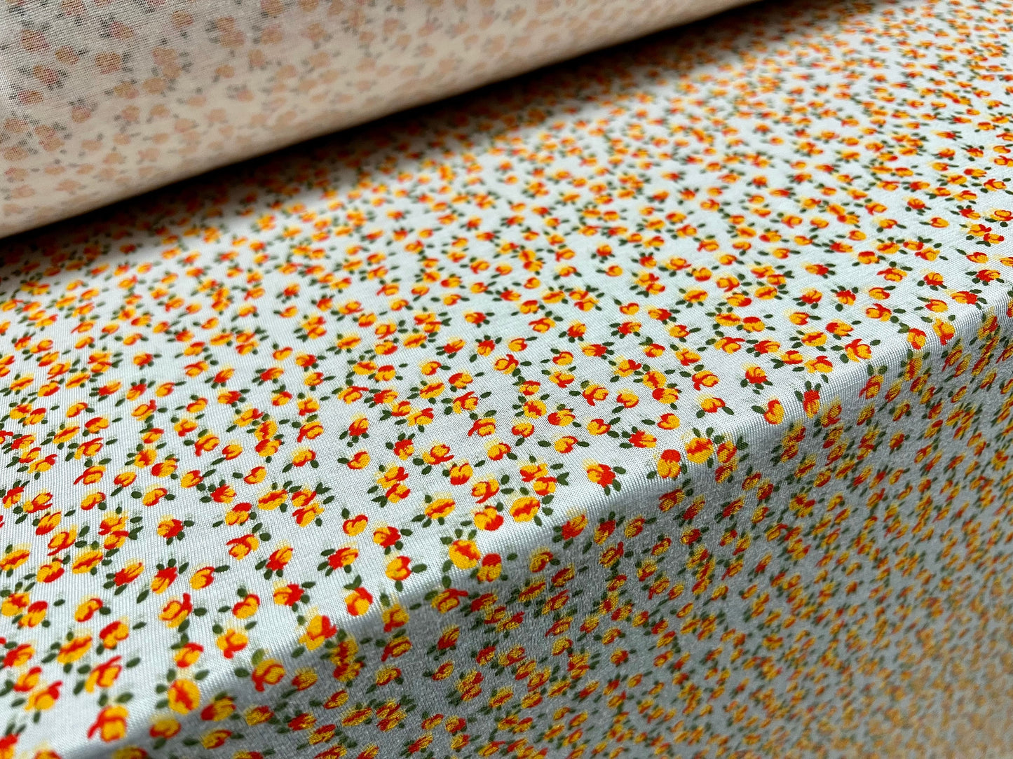 Viscose spandex stretch jersey fabric, per metre - small ditsy flower print - white & orange