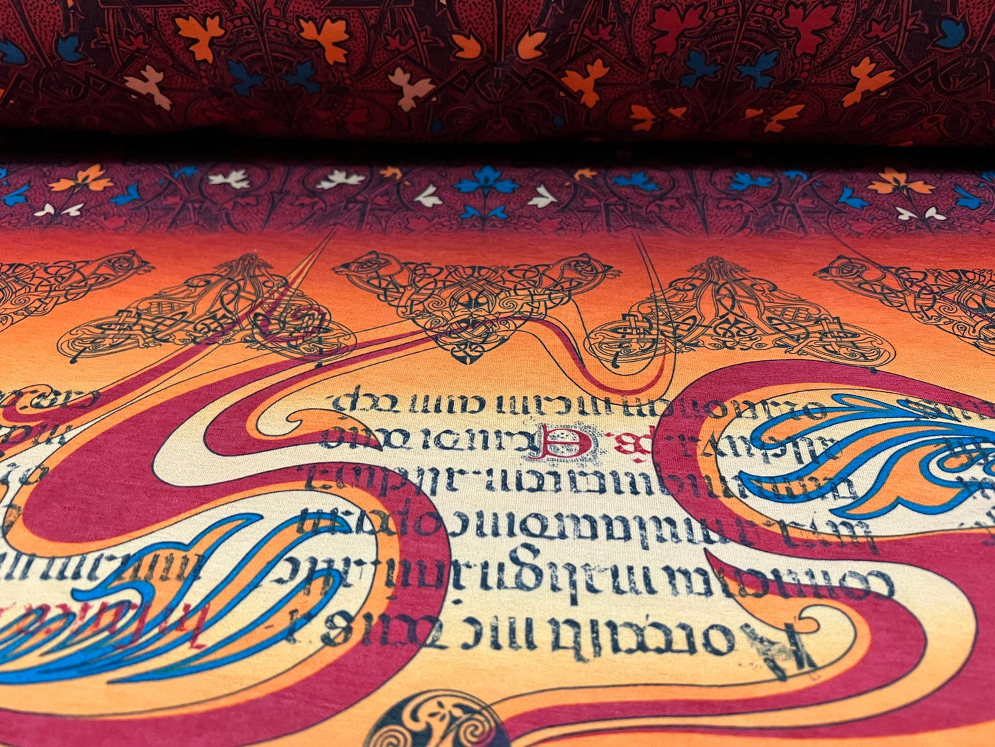Stretch spandex single jersey fabric, per metre - Celtic braid print - Orange & wine