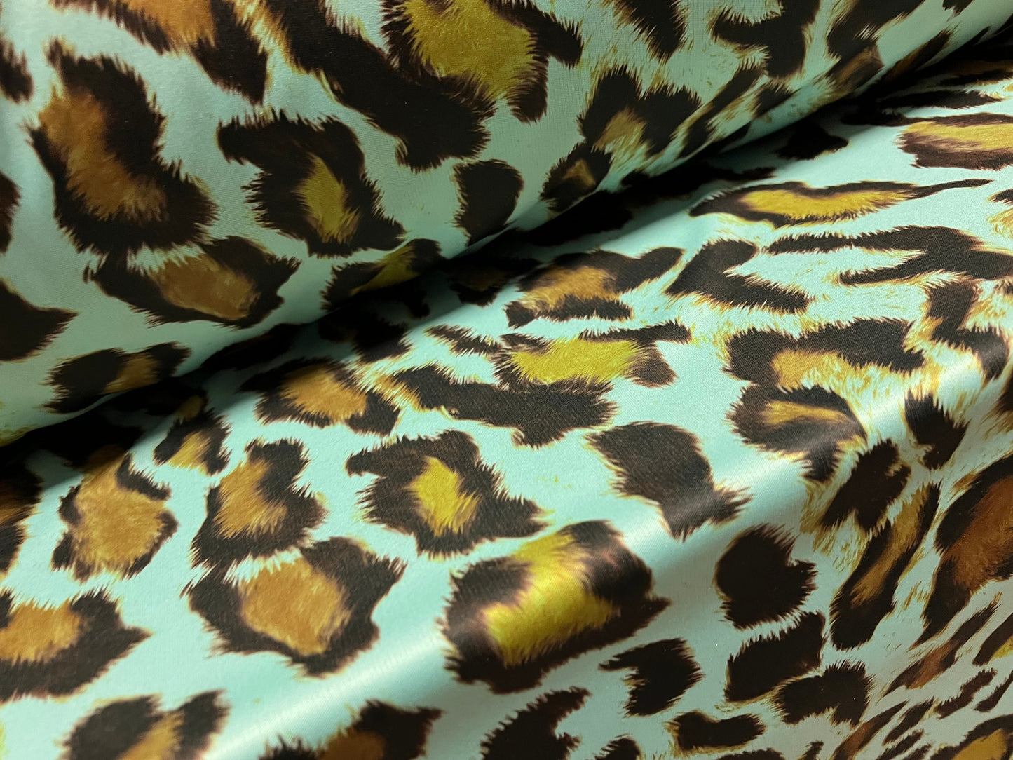 Single jersey polyester fabric - 60 inches wide - leopard animal print - turquoise