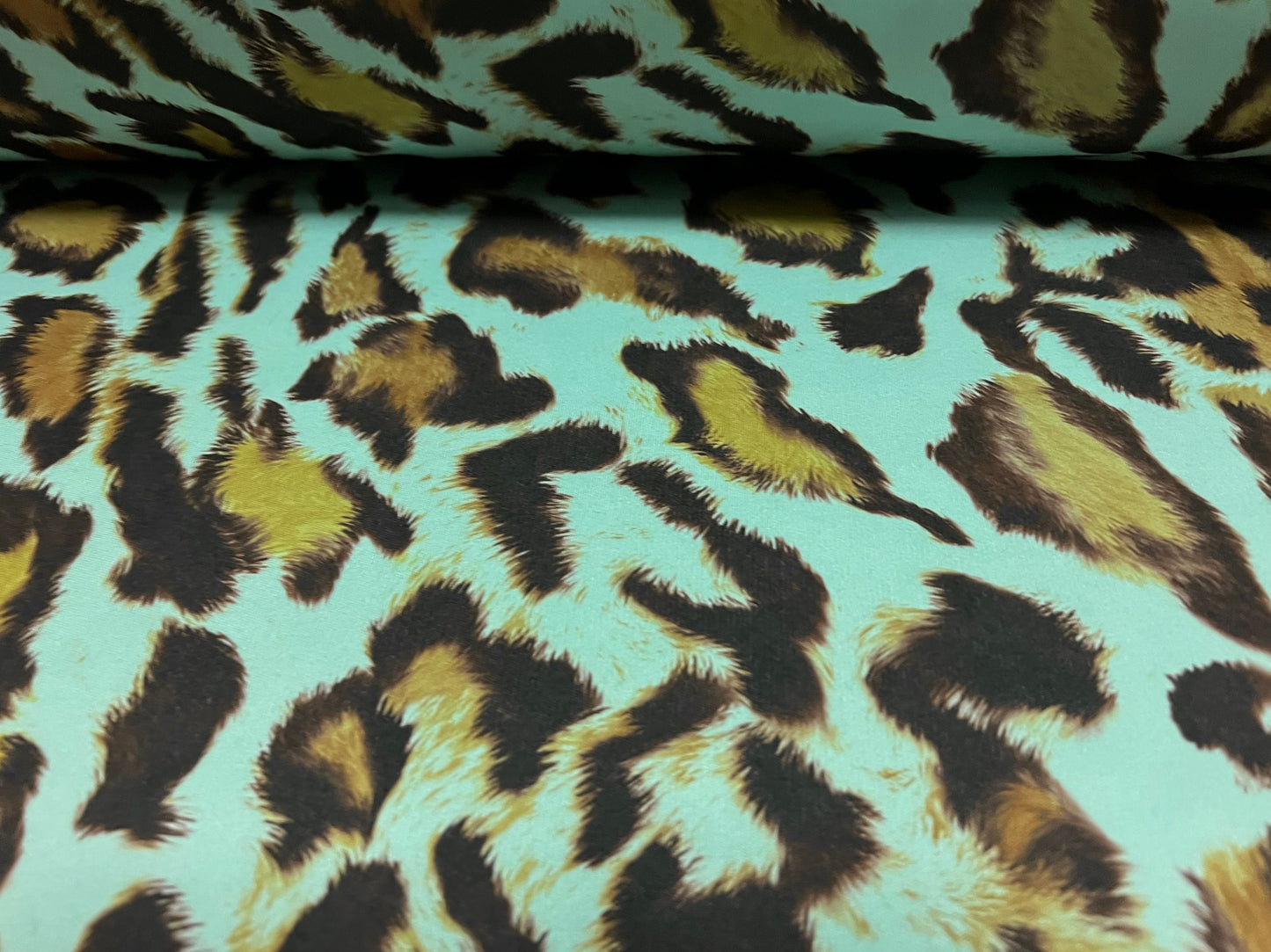 Single jersey polyester fabric - 60 inches wide - leopard animal print - turquoise