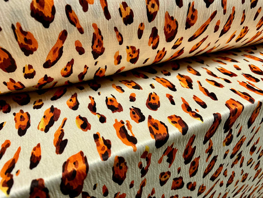 Single jersey fashion fabric, per metre - distressed Leopardskin animal print - cream & orange
