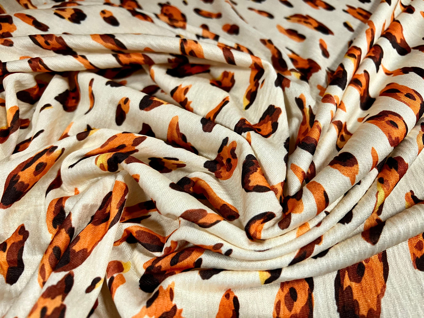 Single jersey fashion fabric, per metre - distressed Leopardskin animal print - cream & orange