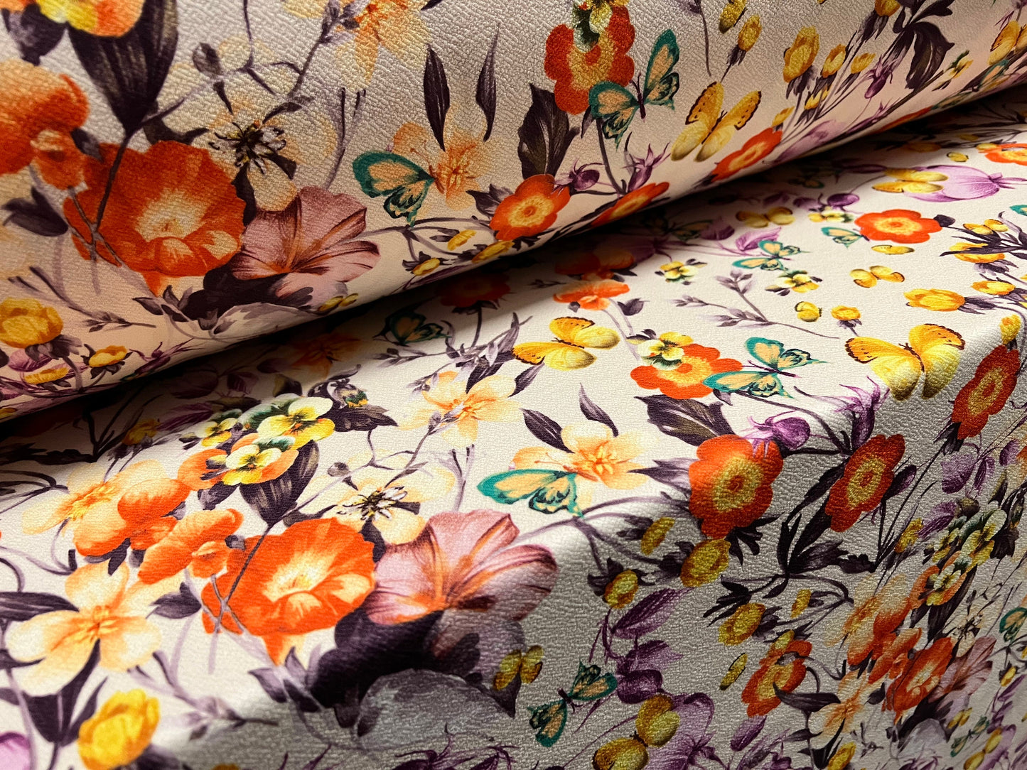 Scuba textured ‘Liverpool’ stretch spandex jersey fabric, per metre - Cream with orange and lilac flowers & butterflies print