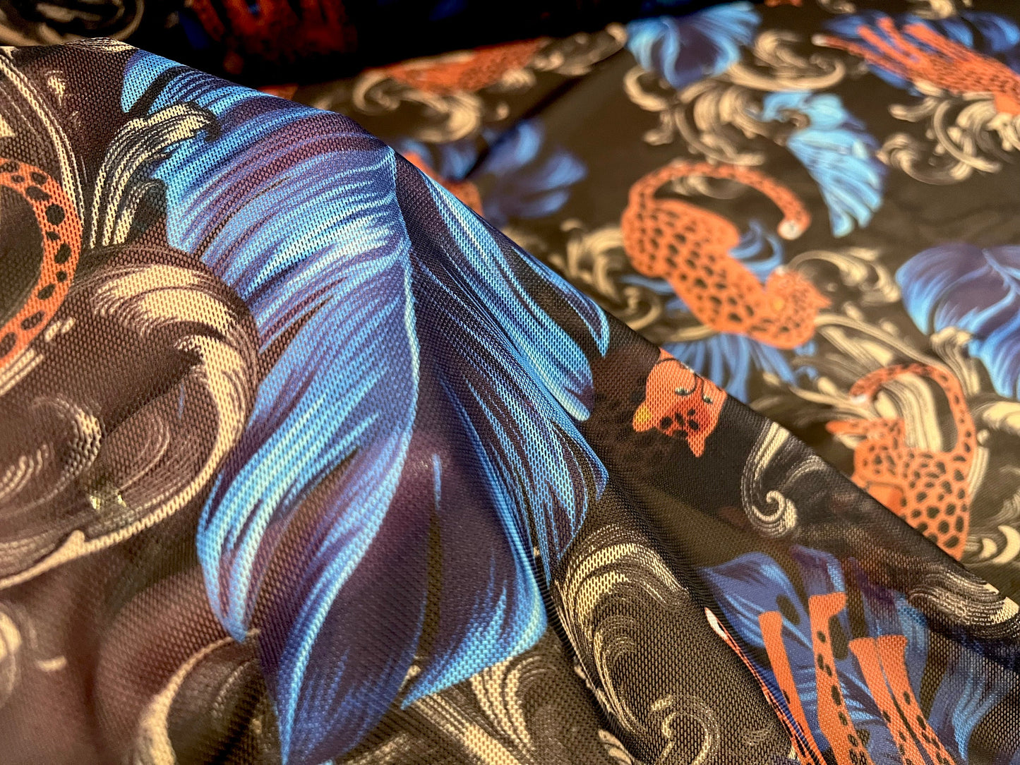 Power mesh net stretch spandex fabric, per metre - Leopardskin & feathers print - black orange blue