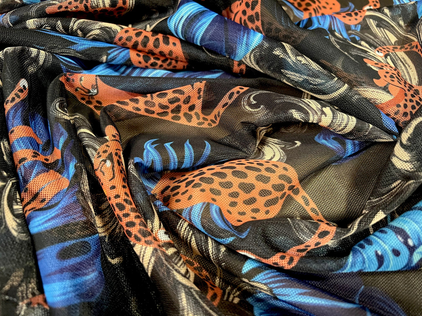 Power mesh net stretch spandex fabric, per metre - Leopardskin & feathers print - black orange blue