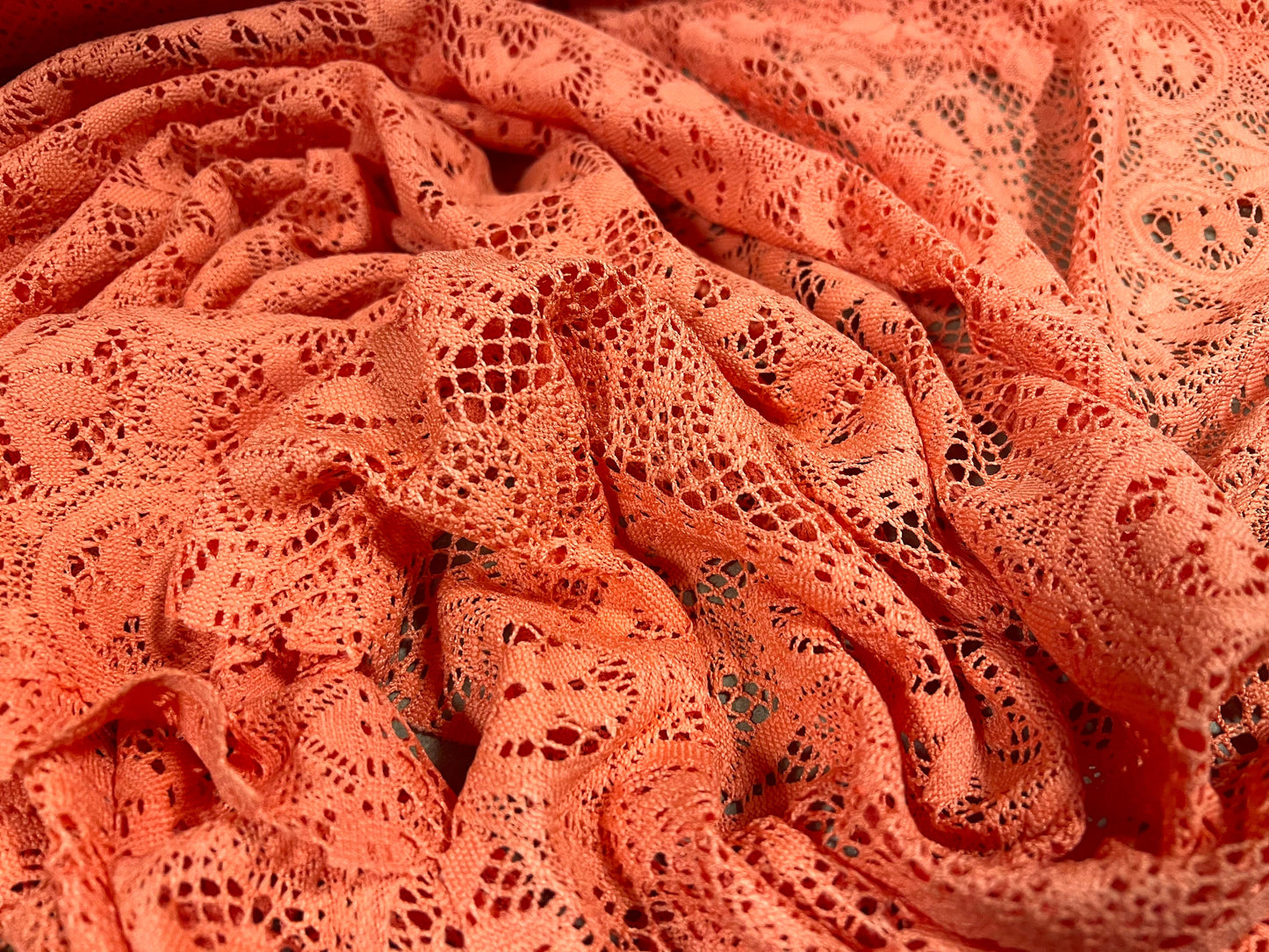 Soft handle crochet lace knit fabric, per metre - coral