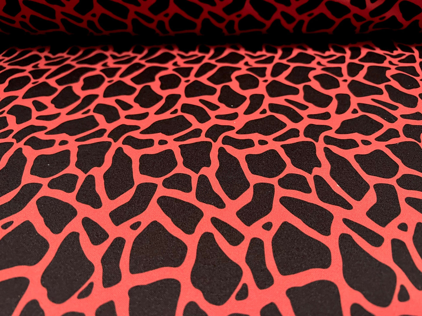 Scuba neoprene style double jersey stretch fabric, per metre - giraffe animal print - orange & black