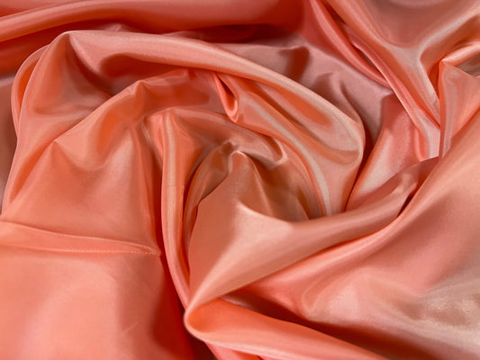 Woven polyester lining fabric, per metre - plain - peach Melba