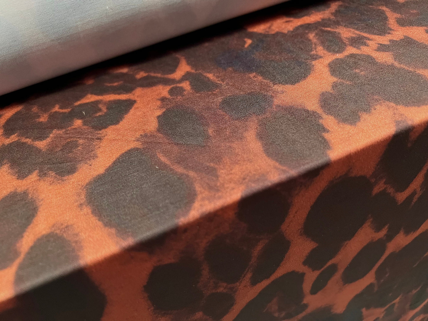 Stretch spandex single jersey fashion fabric, per metre - hyena animal print - chestnut brown black & navy