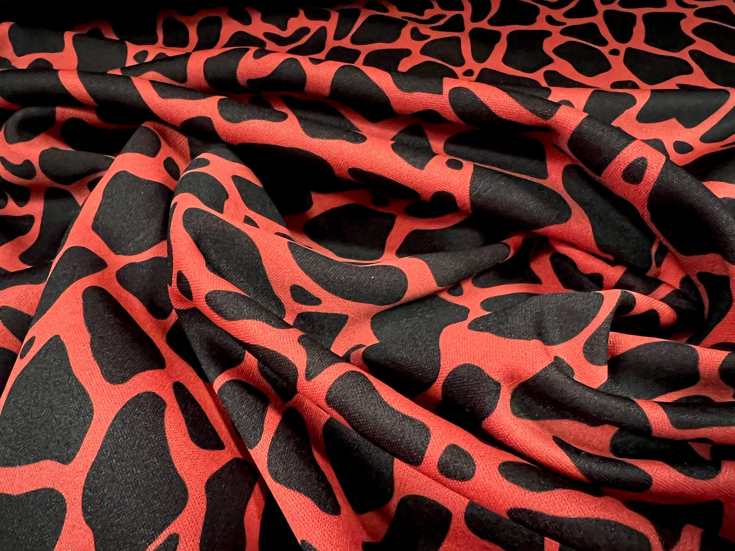 Scuba neoprene style double jersey stretch fabric, per metre - giraffe animal print - orange & black
