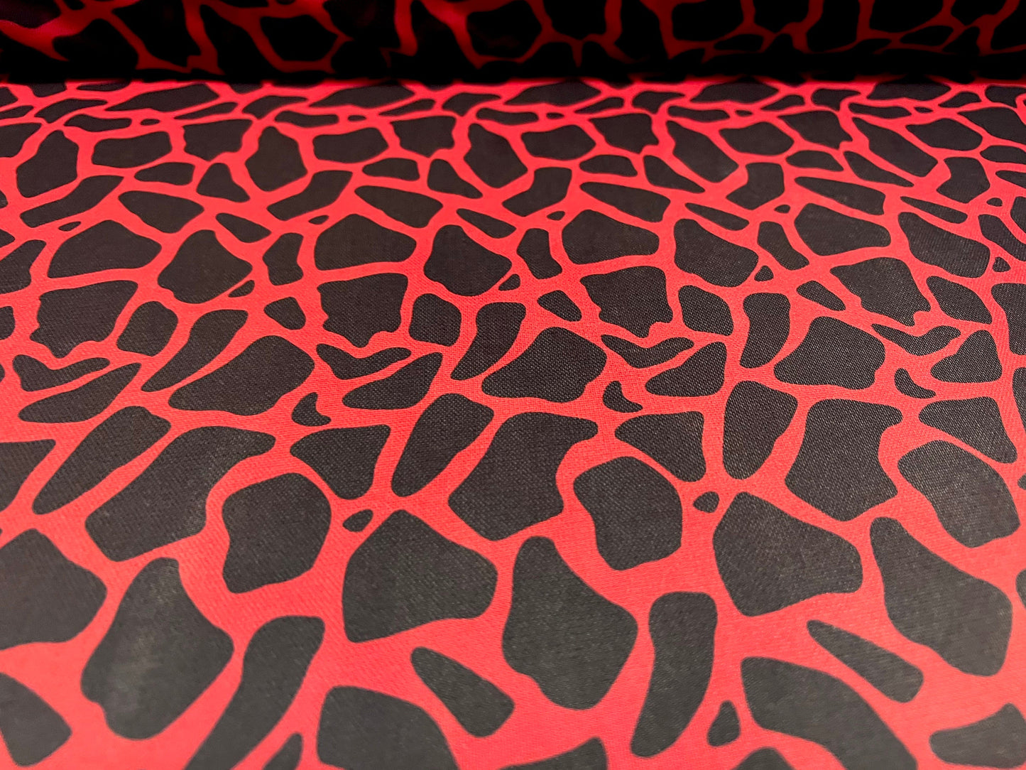 Power mesh net stretch spandex fabric, per metre - giraffe animal print - red & black