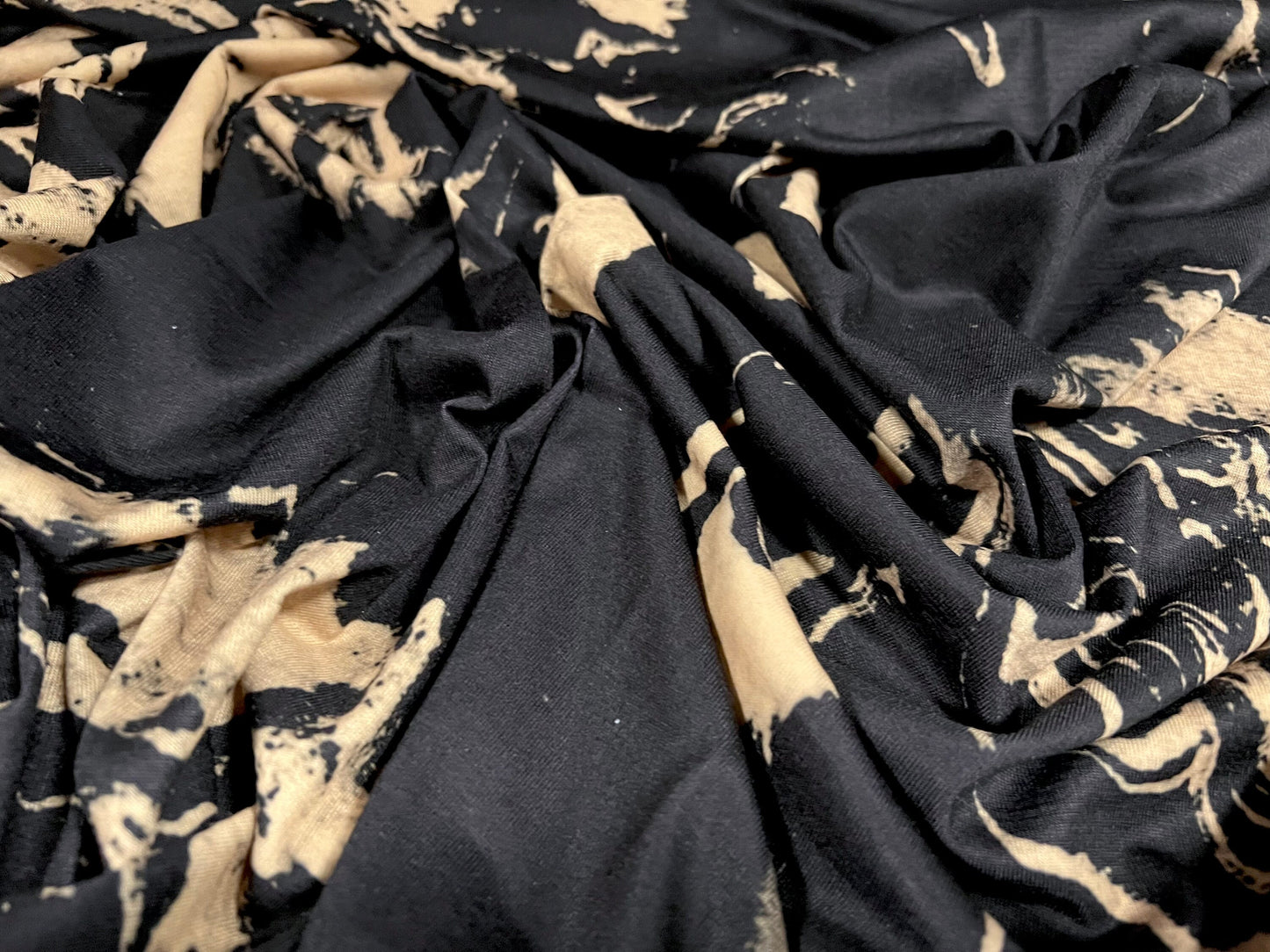 Soft handle stretch spandex jersey fabric, per metre - paint spill print - black & tan
