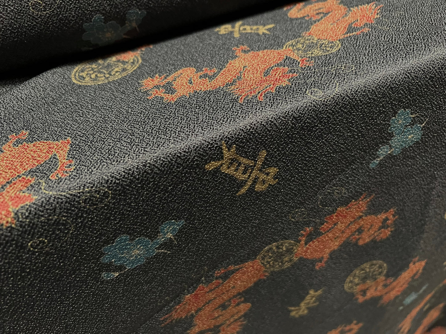 Woven textured crepe fabric, per metre - Oriental dragon print - dark grey & orange