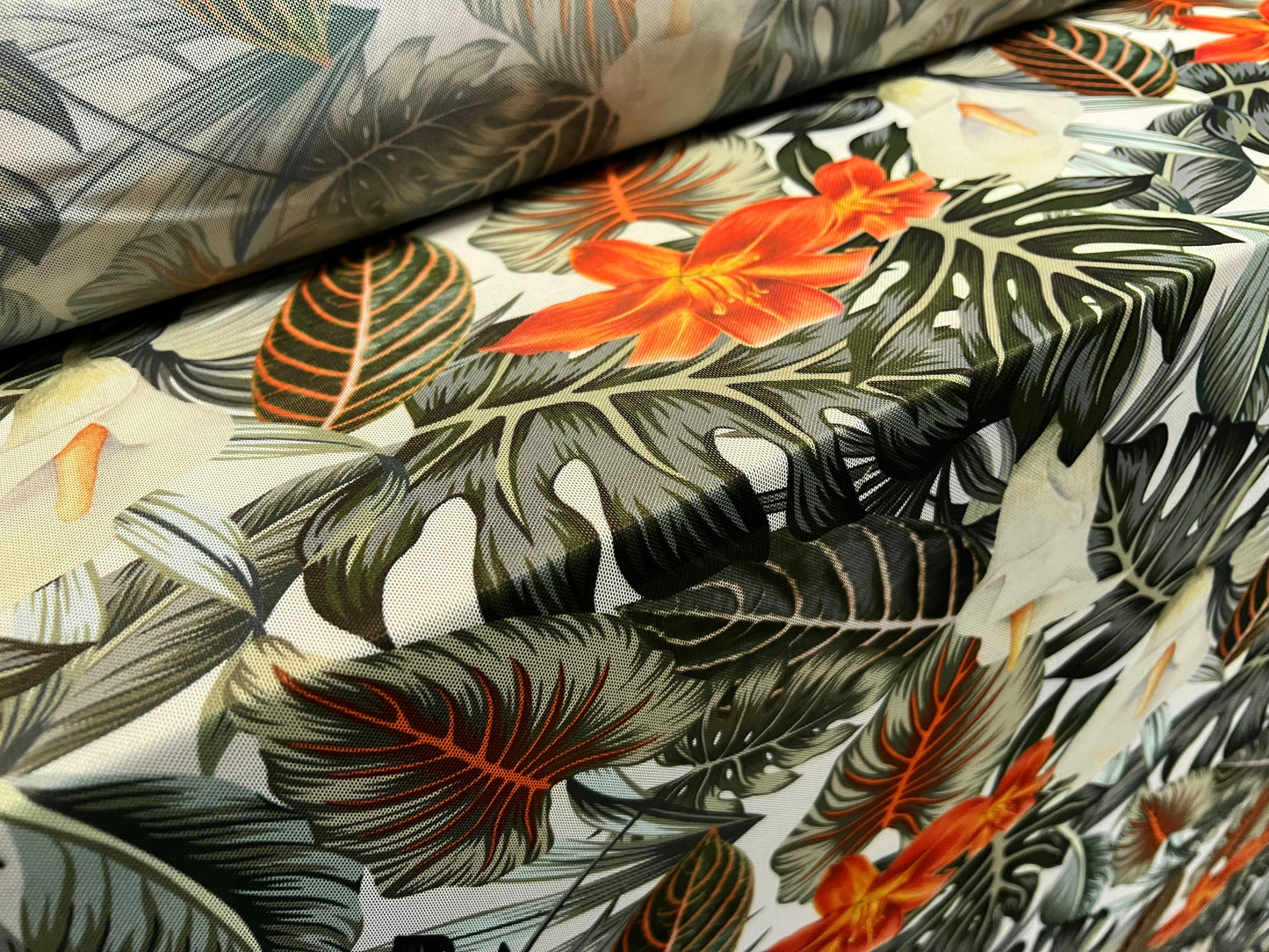 Power mesh net stretch spandex fabric, per metre - tropical jungle flower print - green & orange