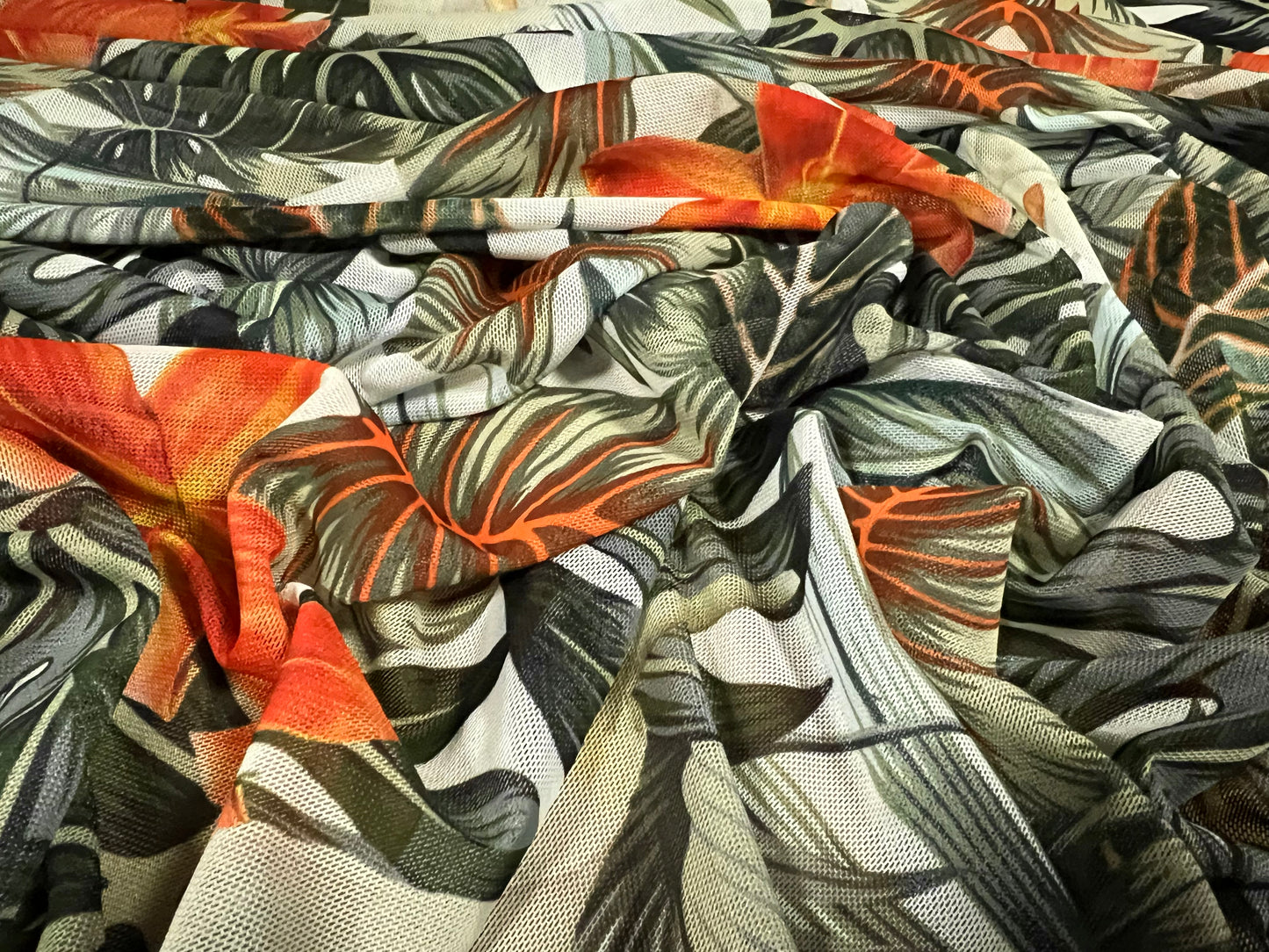 Power mesh net stretch spandex fabric, per metre - tropical jungle flower print - green & orange