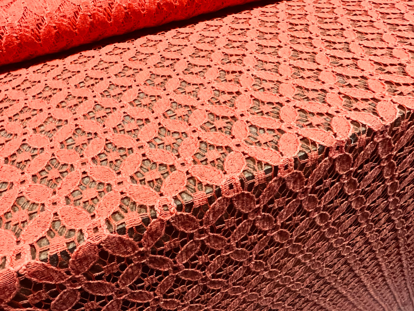 Lace dress fabric, per metre - quatrefoil floral design - coral