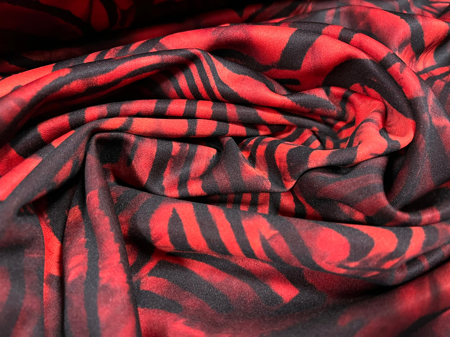 Scuba stretch spandex neoprene style jersey fashion fabric, per metre - distressed zebra print - burnt orange & black