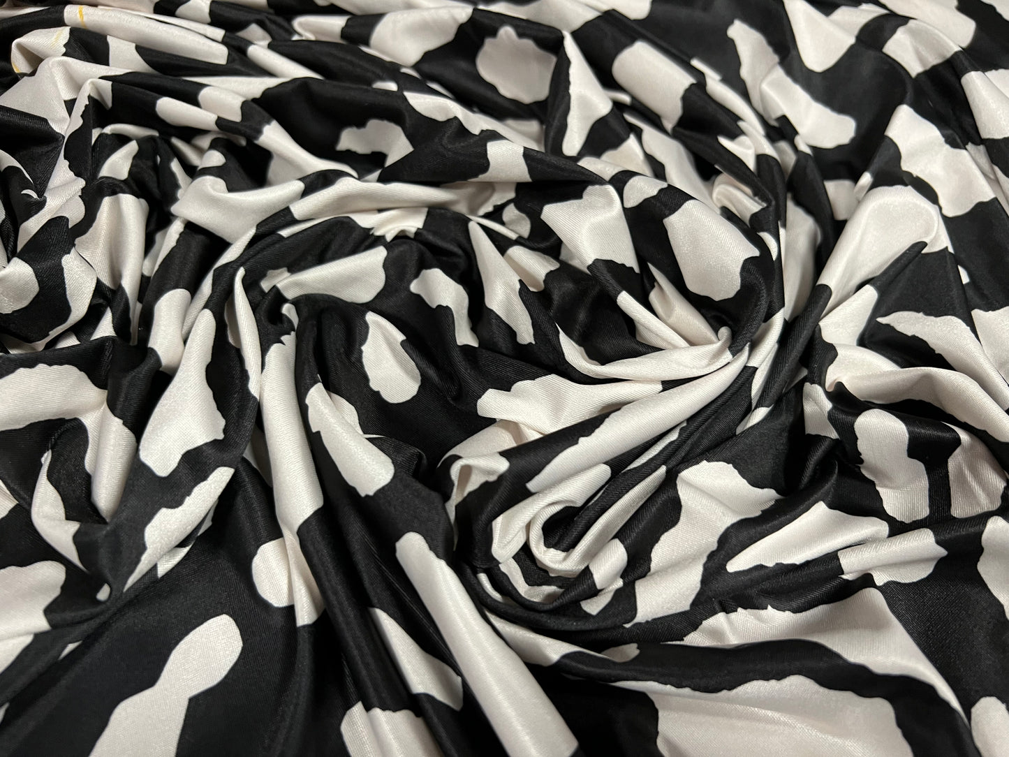 Soft touch stretch spandex single jersey fabric, per metre - cow print - black & cream