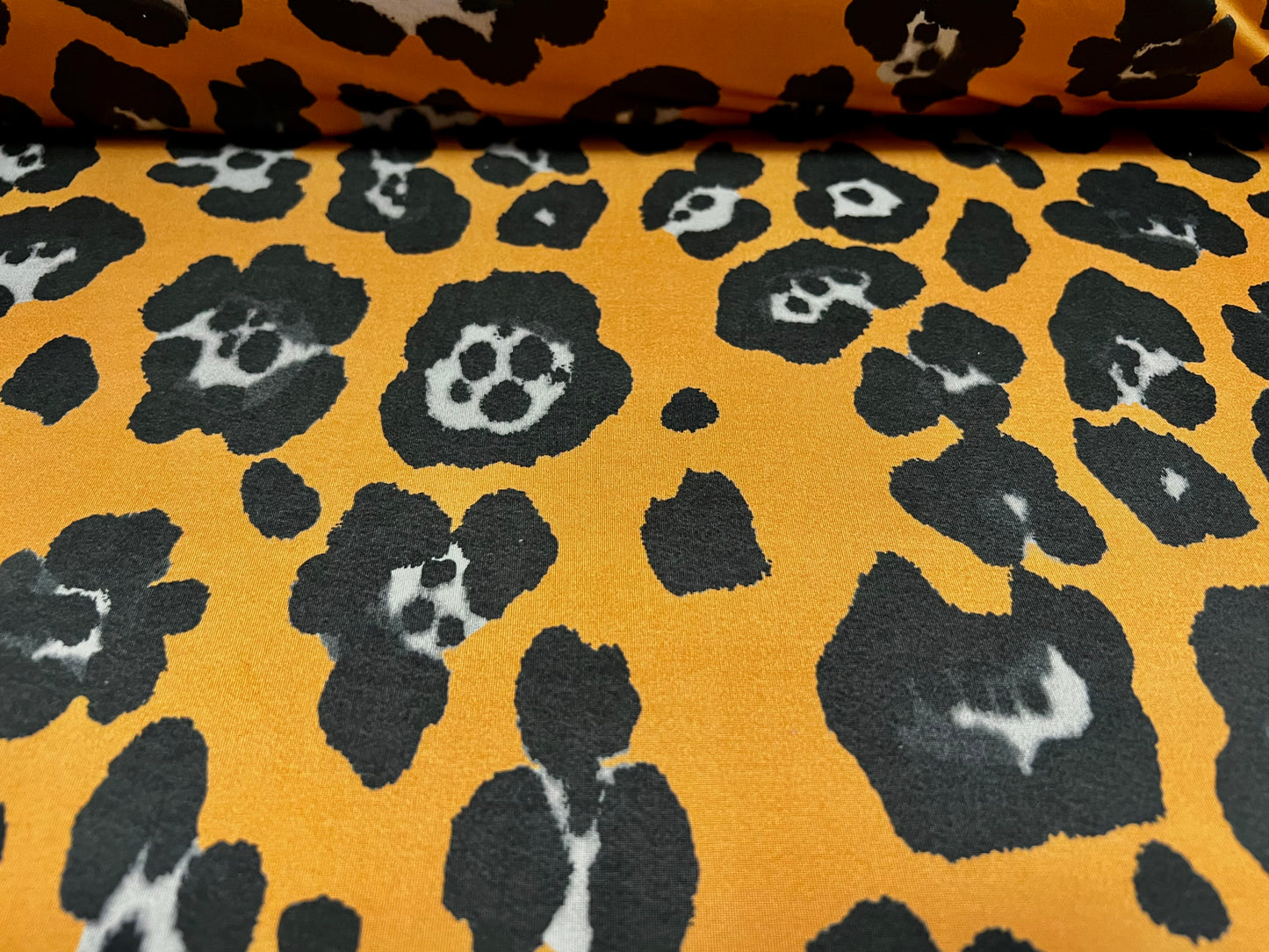 Soft touch stretch spandex single jersey fabric, per metre - jaguar animal print - amber