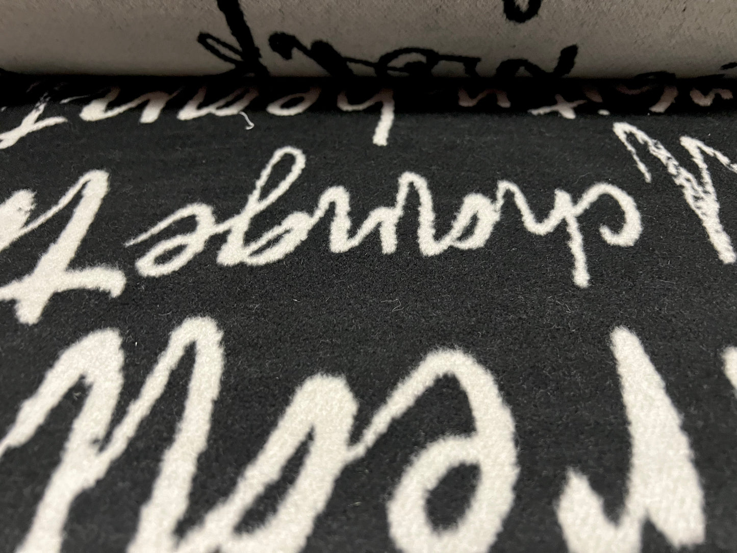 Wool mouflon flannel fabric, per metre - artistic diversity words jacquard - black & grey