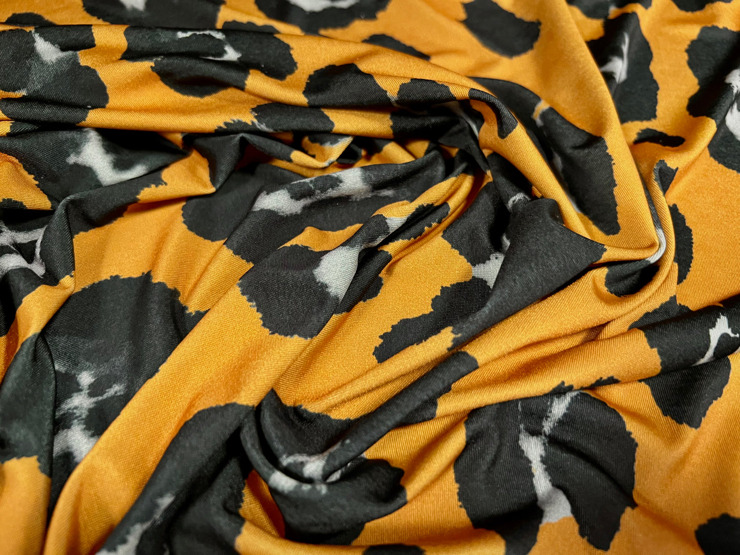 Soft touch stretch spandex single jersey fabric, per metre - jaguar animal print - amber