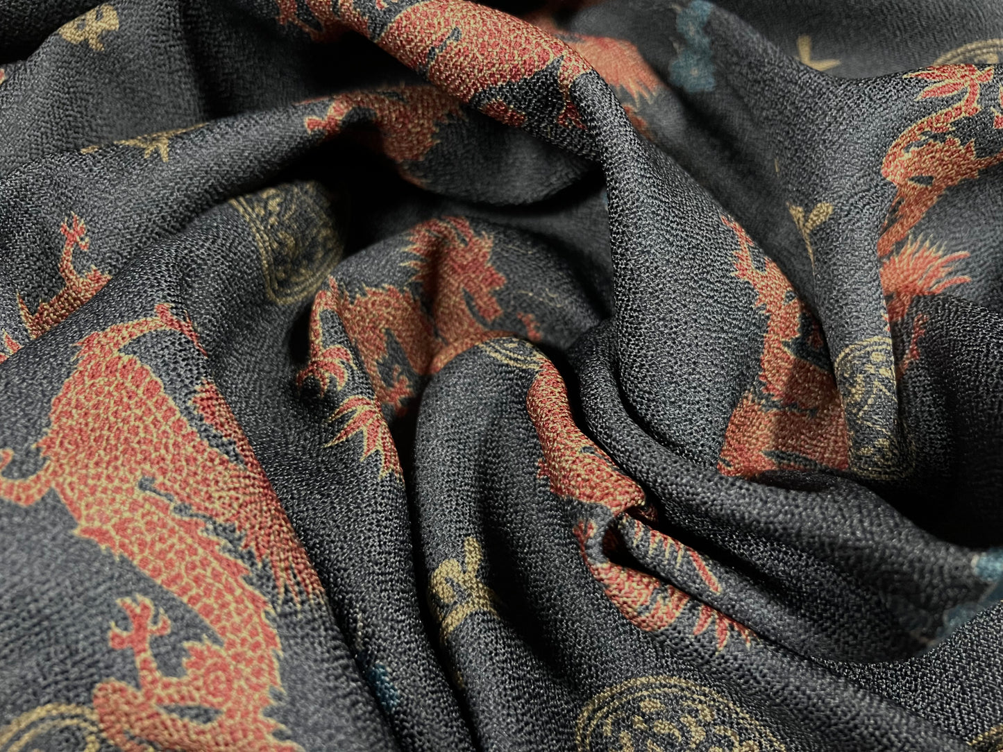 Woven textured crepe fabric, per metre - Oriental dragon print - dark grey & orange